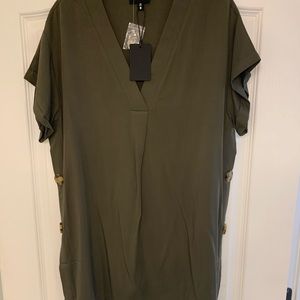 Green tunic with buttons on the sides